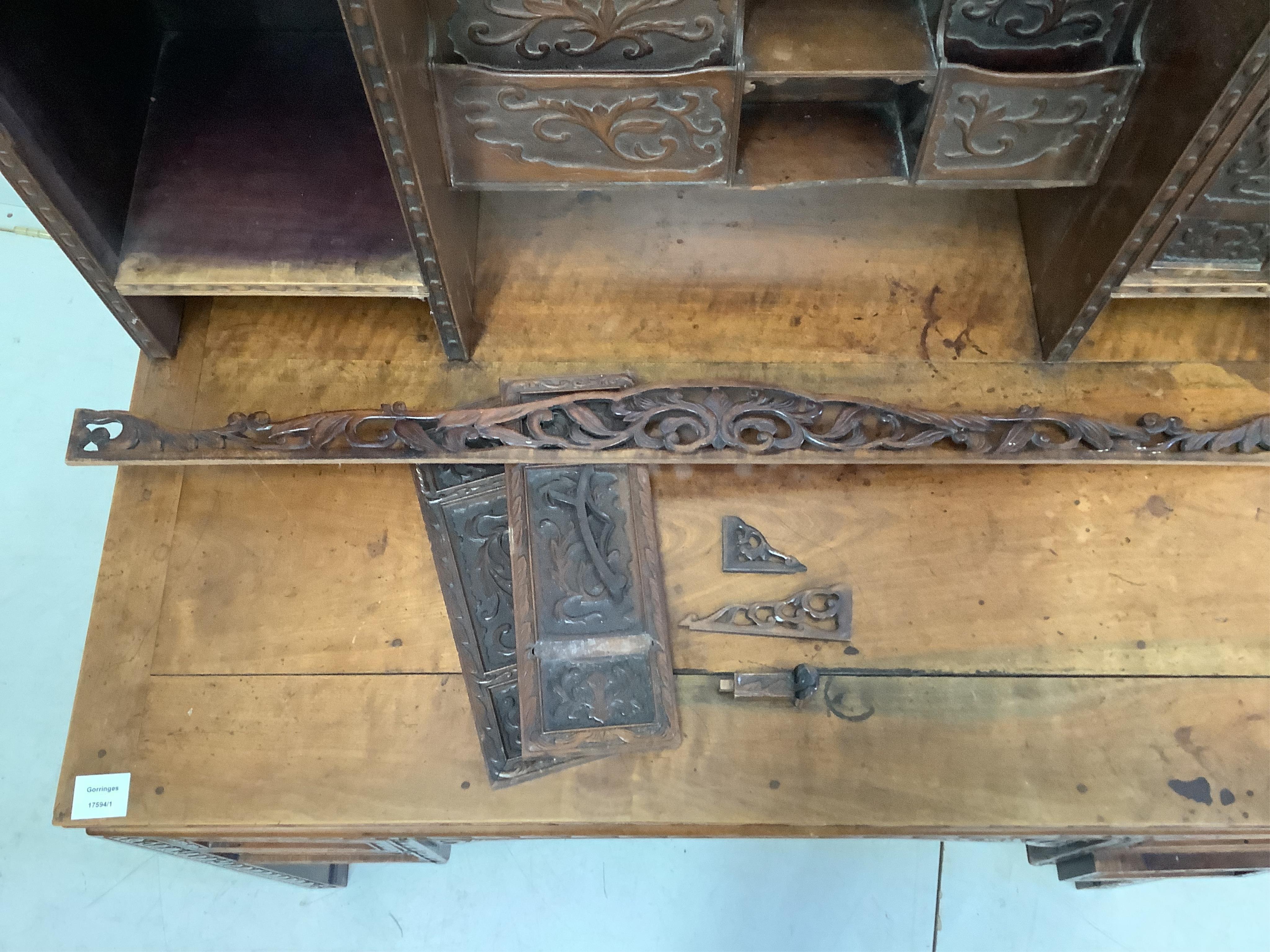 A late 19th century Chinese export carved hardwood kneehole writing desk, width 107cm, depth 66cm, height 120cm
